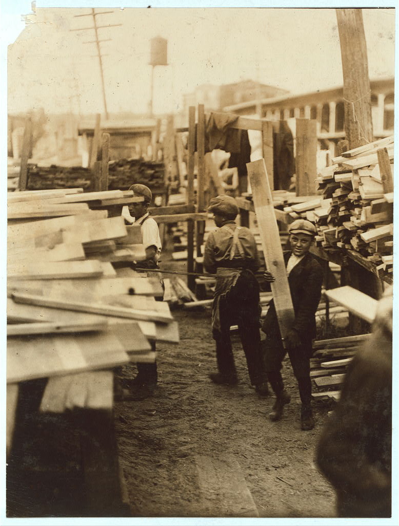 Young boys working for Hickok Lumber Co. in Burlington, Vermont. Photograph by Lewis W. Hine, September 1910. Library of Congress